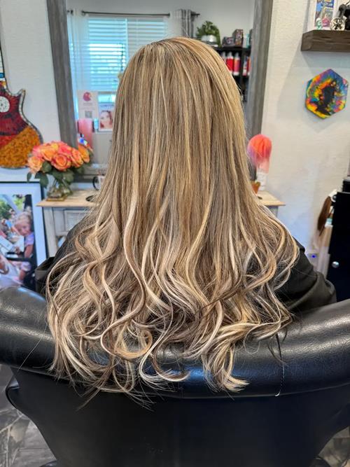 Hair Extensions photo, Denver Colorado. in this photo, we wanted to make the bottom of her hair look(..)